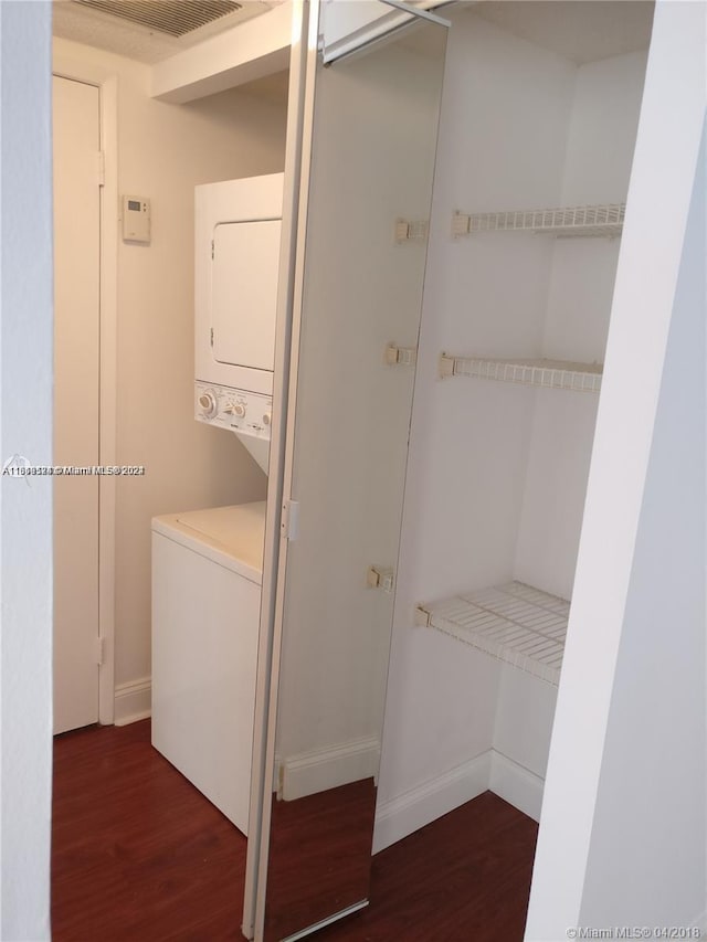 closet featuring stacked washer / dryer