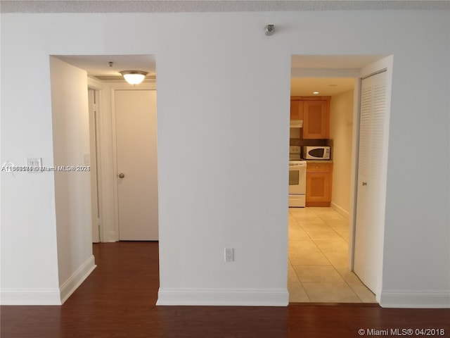 corridor featuring hardwood / wood-style flooring