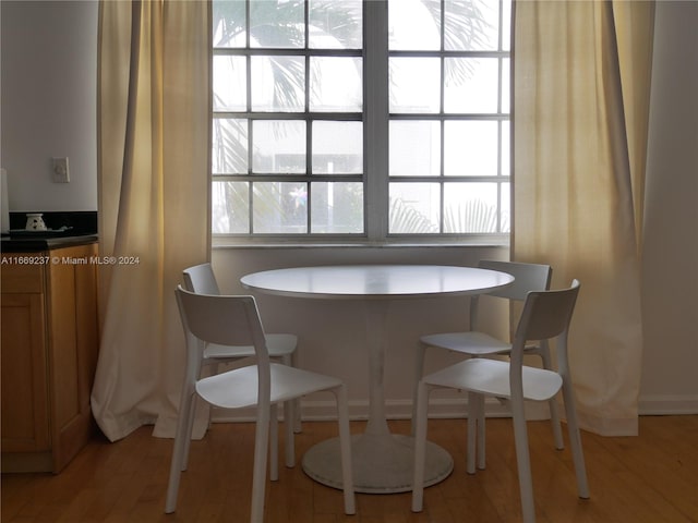 dining space featuring light hardwood / wood-style floors