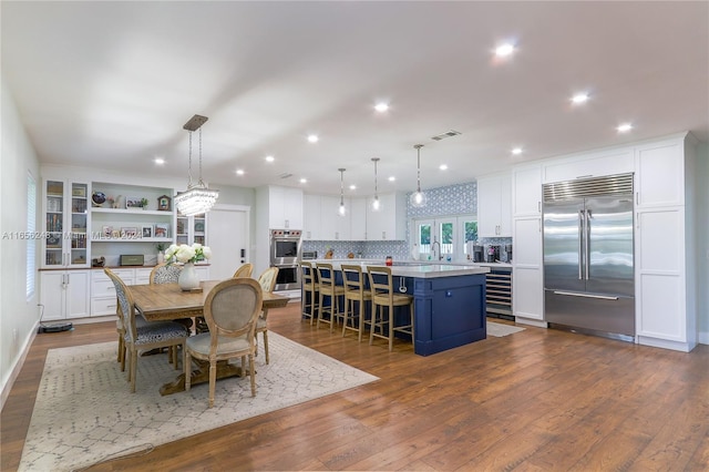 dining space with sink and dark hardwood / wood-style flooring