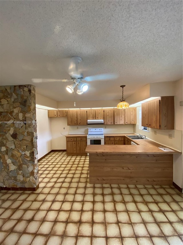 8203 SW 23rd Ct Unit 21B, North Lauderdale, FL 33068 - kitchen with white electric range oven, extractor fan, a peninsula, a textured ceiling, and a ceiling fan