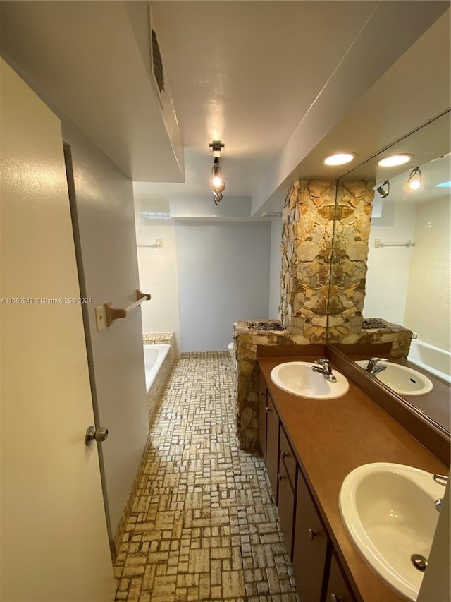 8203 SW 23rd Ct Unit 21B, North Lauderdale, FL 33068 - full bath featuring a bathtub, double vanity, and brick patterned flooring
