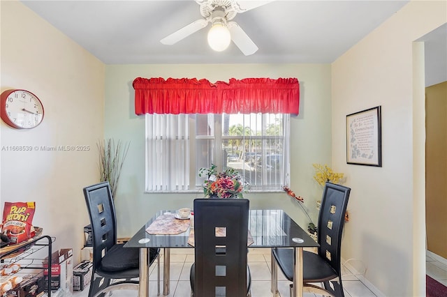 tiled dining area featuring ceiling fan