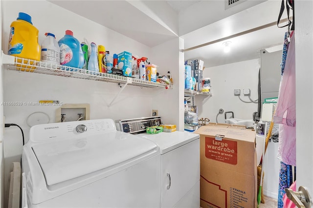 clothes washing area with independent washer and dryer