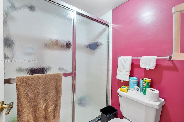 bathroom with toilet and walk in shower