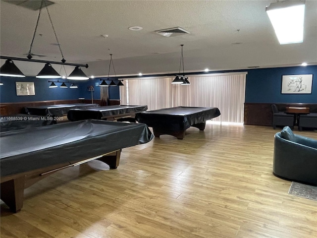 rec room with light hardwood / wood-style flooring and billiards