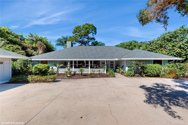 single story home featuring covered porch