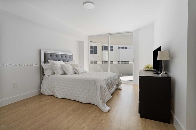 kitchen with white cabinetry, appliances with stainless steel finishes, and dark hardwood / wood-style flooring