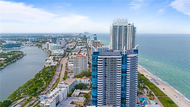 aerial view featuring a view of the beach and a water view