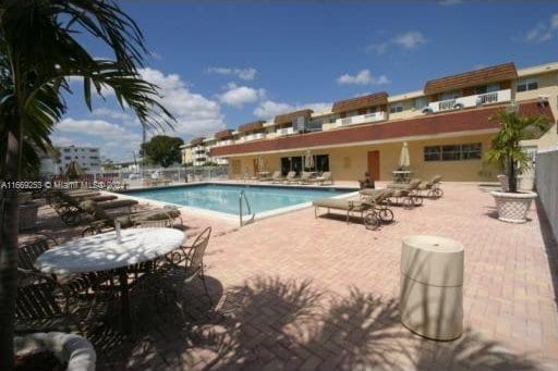 view of swimming pool featuring a patio