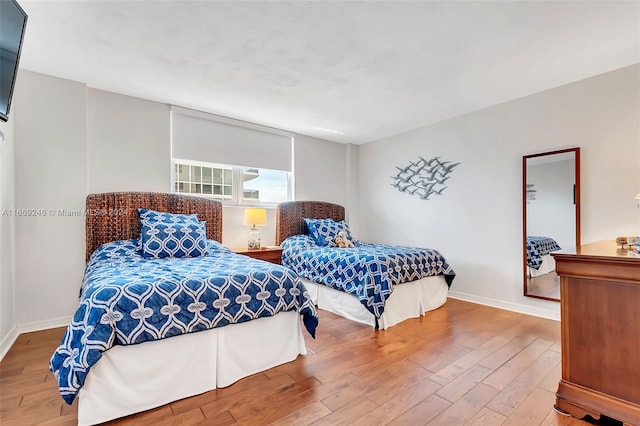 bedroom with hardwood / wood-style floors