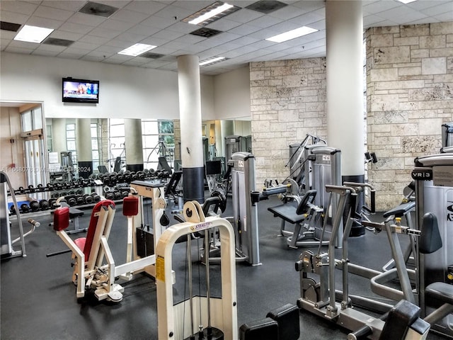 exercise room with a paneled ceiling