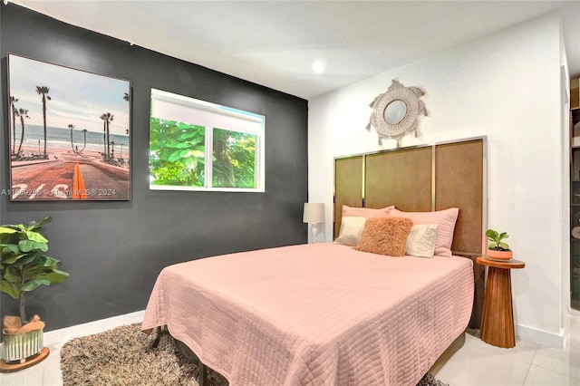 bedroom featuring light tile patterned floors