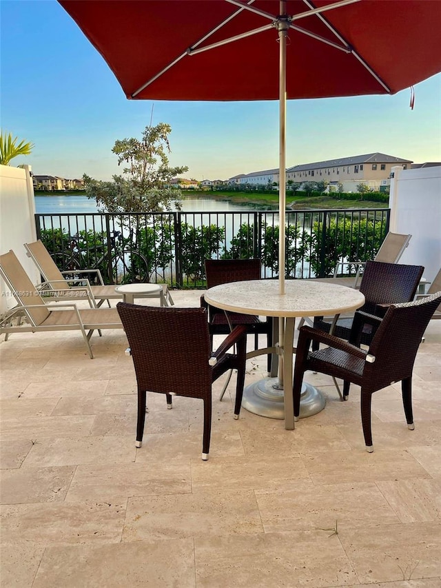 view of patio with a water view