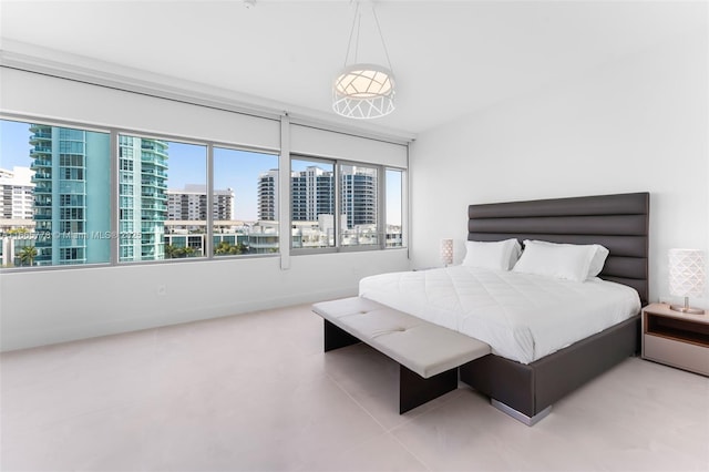 bedroom with light tile patterned floors