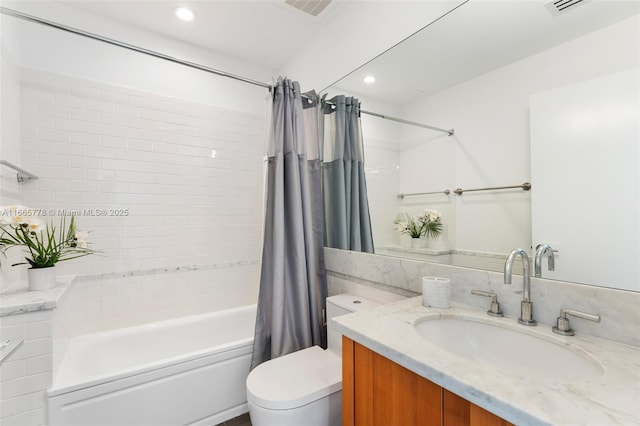 full bathroom featuring vanity, toilet, and shower / tub combo