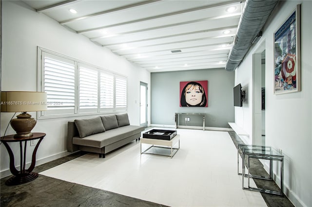 living room with beam ceiling