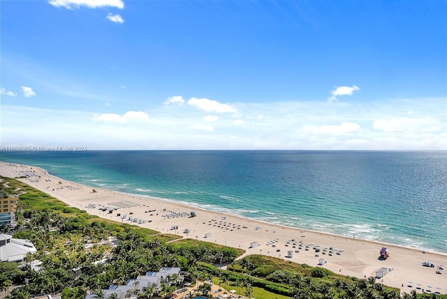 drone / aerial view featuring a view of the beach and a water view