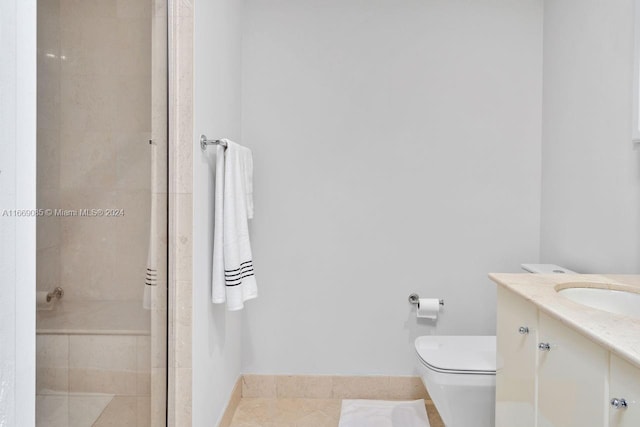 bathroom with tile patterned floors, an enclosed shower, vanity, and toilet