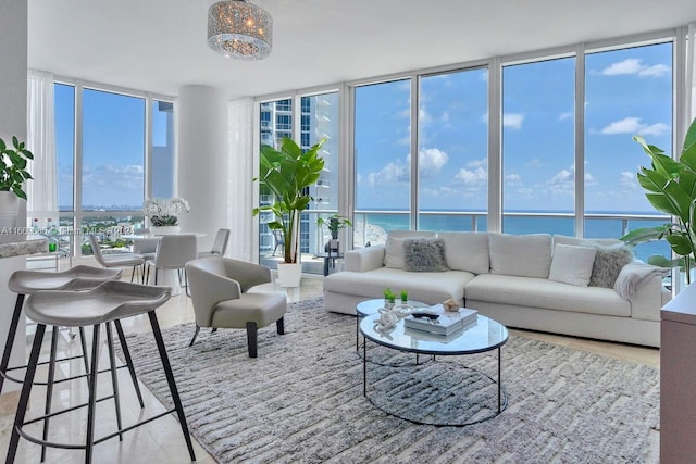 100 S Pointe Dr Unit 2208, Miami Beach, FL 33139 - living area featuring floor to ceiling windows, plenty of natural light, and a water view