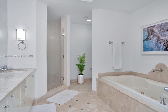 bathroom featuring tile patterned flooring, vanity, and separate shower and tub