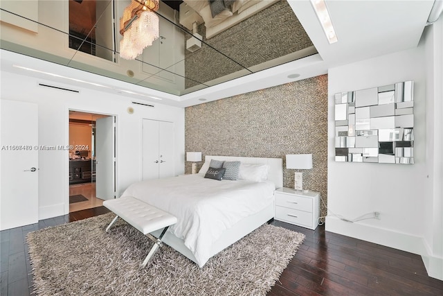 bedroom featuring dark hardwood / wood-style flooring