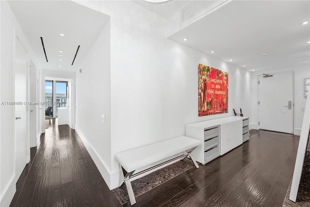 hallway with dark hardwood / wood-style floors