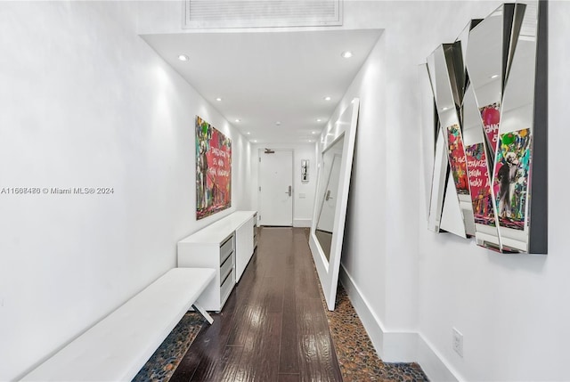 corridor featuring dark hardwood / wood-style flooring