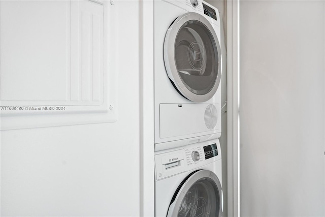 washroom with stacked washer / dryer