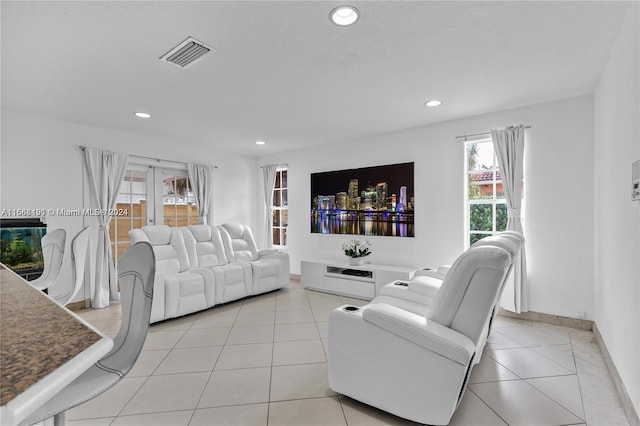 living room featuring french doors and a textured ceiling