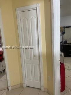 corridor featuring tile patterned flooring