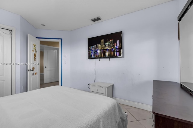 bedroom featuring light tile patterned floors