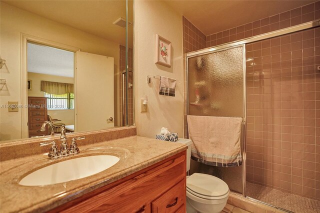 kitchen featuring light stone counters, white appliances, ceiling fan, sink, and light tile patterned floors