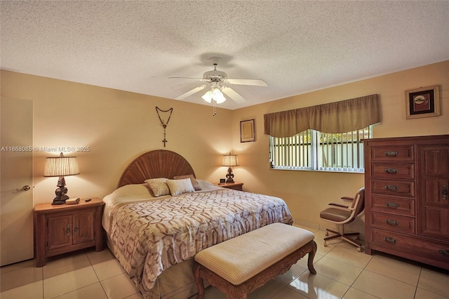 tiled bedroom with ceiling fan and a textured ceiling