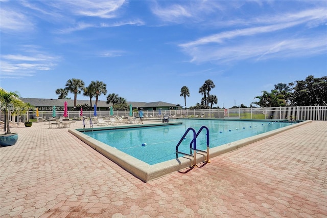 view of swimming pool with a patio