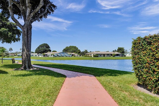 surrounding community featuring a lawn