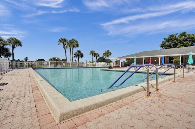 view of swimming pool with a patio