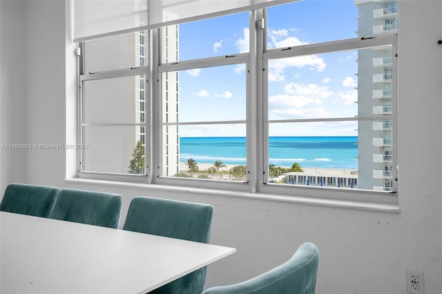 dining room featuring a water view