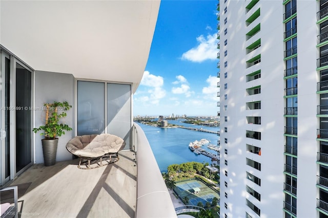 balcony featuring a water view