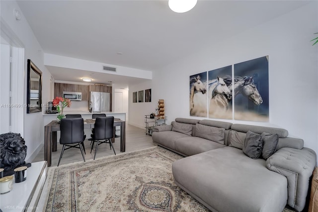 living room with light hardwood / wood-style floors