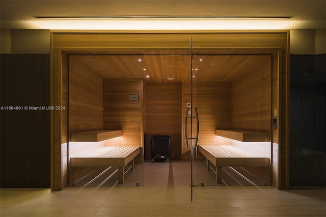 view of sauna featuring wood walls