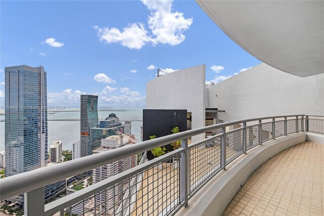 balcony featuring a water view