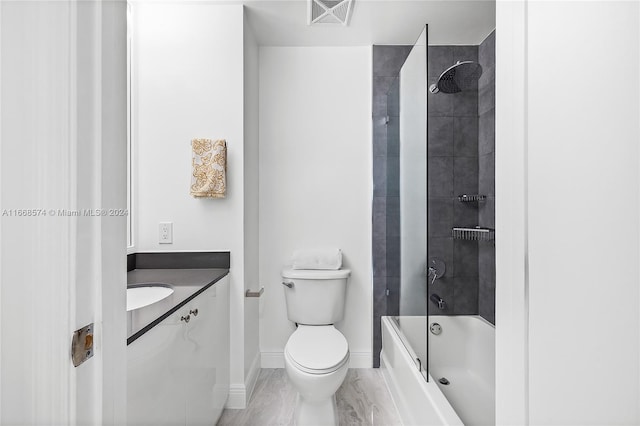 full bathroom with vanity, toilet, and tiled shower / bath