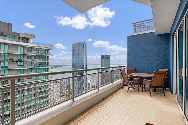 balcony featuring a water view