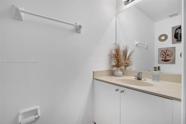bathroom with vanity and visible vents