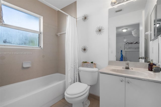 bathroom with vanity, toilet, tile patterned floors, shower / bath combination with curtain, and visible vents