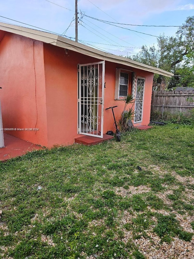 view of outbuilding featuring a yard