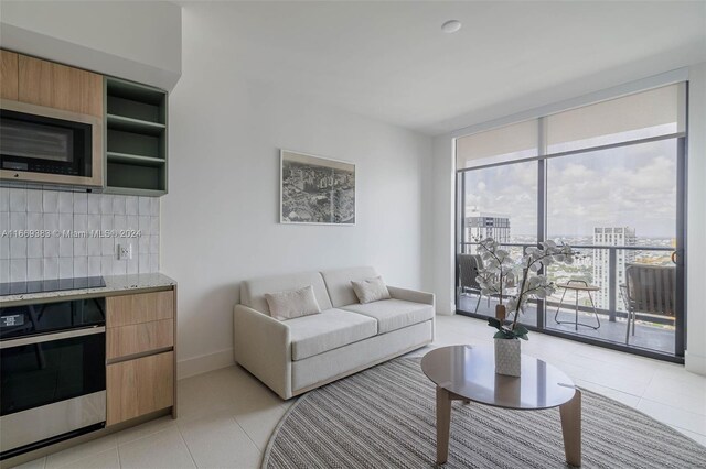 living room with light tile patterned floors