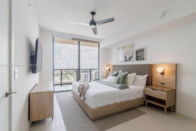 tiled bedroom with floor to ceiling windows, ceiling fan, and access to exterior