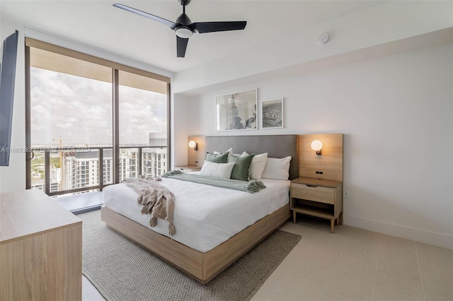 bedroom featuring access to outside, floor to ceiling windows, multiple windows, and ceiling fan